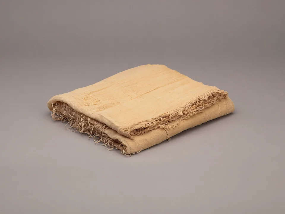 Folded ivory linen showing the fine weave of the cloth (conceptual image)